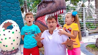 Diana and Roma walk in the Dinosaur park & Museum of Illusions