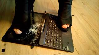 Crushing laptop in high heels