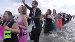 USA: See fancy-dressed beachgoers get all wet in NYC