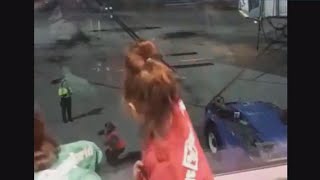 Young girls have impromptu dance-off with airport employee