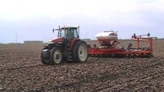 Versatile 2180 Tractor puliing a White 16 row corn planter in Iowa