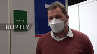 Germany: People queue at vaccination centre in Potsdam open on Christmas