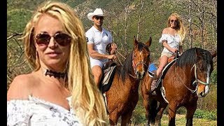 Britney Spears, 38, wears an off-the-shoulder blouse as she rides horses with her 'prince' Sam Asgha