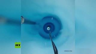 Traveling down a 650m-deep blue hole in an Antarctic ice shelf