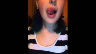 Hot girl playing with her tongue ring
