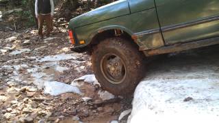 Range Rover Classic going down rock ledge at wooly