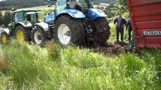Tractor and trailer struck in mud.
