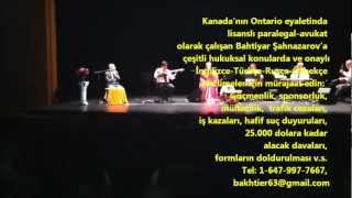 A Boy Plays Nintendo during Azeri Classical Mugam Song Concert of Nuriye Huseynova