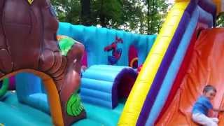 Kids playing at outdoor playground with balls .