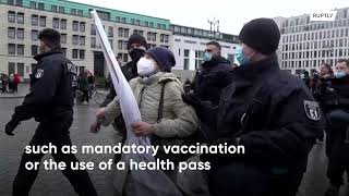 Scuffles as anti-restriction protesters rally across Europe