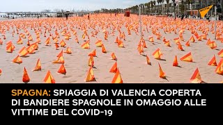 Spagna: spiaggia di Valencia coperta di bandiere spagnole in omaggio alle vittime del COVID-19
