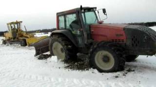 Grader stuck in mud, saving with Valtra 8150 2