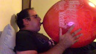 blow to pop big dark red balloon
