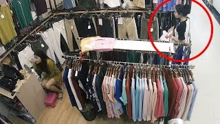 Thief Steals Clothes While Shop Assistant Does Makeup