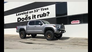 Pair of Two Toyota Tacomas Leveled on 33” Tires Fox Suspension