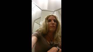 Crossdressing in fitting room school girl skirt.