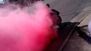 motorcycle smoking tires red smoke
