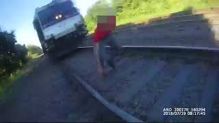 NJ cop runs to save life — train stops within inches!
