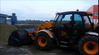 Cute girl driving JCB loader
