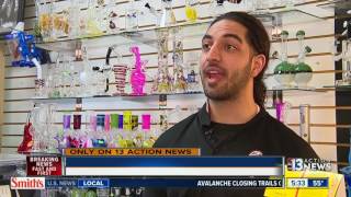 Smoke shop owner stands up to armed thief
