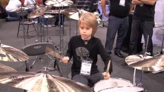 Kids playing drums at NAMM 2013.