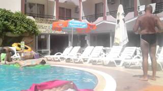 speedo boy struts around the pool