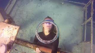 Woman Underwater blowing O rings