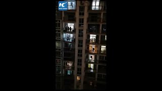 Wuhan residents chant "Jiayou" for city to persist in face of adversity