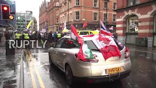 UK: Protesters march against COVID restrix in Manchester as 'UK Freedom Convoy' passes through city