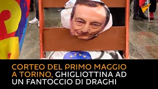 Corteo del primo maggio a Torino, ghigliottina ad un fantoccio di Draghi