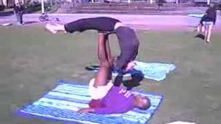 Deborah doing acro-yoga with Ernie at Santa Monica Beach