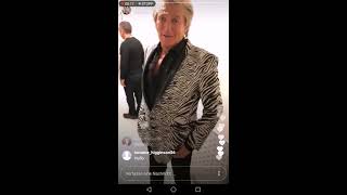 Penny Lancaster escorting Rod Stewart to the Stage