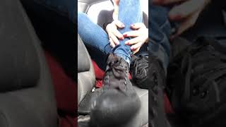 Woman takes off shoes and socks to show off feet