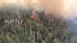 USA: National Guard dump water on wildfire from helicopter in California