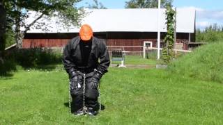 Full covered in PVC Rainwear, gasmask and chains
