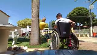 An Amputee Man Is Using Land Mower.