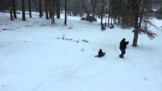 BIG GIRL tramples little kid on a SNOW sled