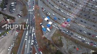 Drone captures endless queue of cars waiting at drive-through COVID testing station in Perugia