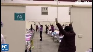 Patients with coronavirus dance at a temporary hospital in Wuhan