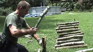 Splitting fire wood with a Kabar and Baton