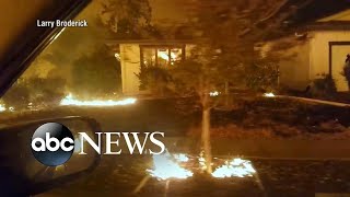 Wildfires cause Californians to flee, sift through burned homes