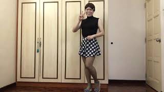 Black top, blank n white skirt and grey nylons