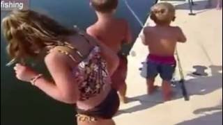 Boy Catches Hybrid Striped Bass with Spider Man Fishing Rod