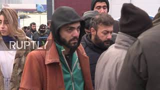 Belarus: Stranded migrants flock to collect aid at Bruzgi logistics centre