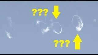 Strange contrail filmed: smoke rings in the air. Pulsating engine or vortex or UFO?