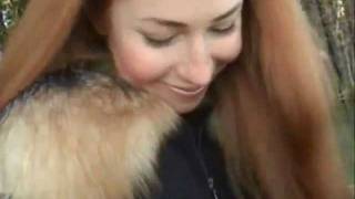 Woman with very long red hair & blue eyes