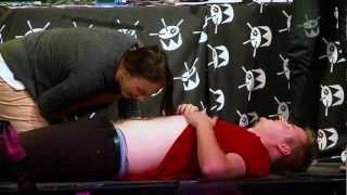 Tom Ballard's belly button gets licked clean