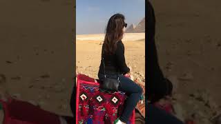 Riding camels in Egypt around the Great Pyramid