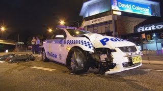 NSW police car severely damaged after driving into traffic light in Beverly Hills
