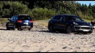 Porsche Cayenne pulls out Volkswagen Touareg from the sand